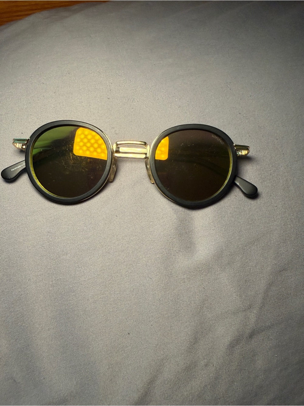 Komono Round Black Frames with Gold Bridge and Green Lenses